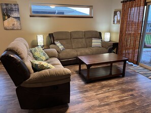 Living room with new couches with recliners for Summer ‘23