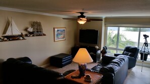 Living room with 55 inch flat screen TV and high speed internet access and cable