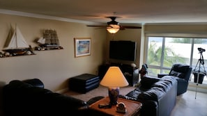 Living room with 55 inch flat screen TV and high speed internet access and cable
