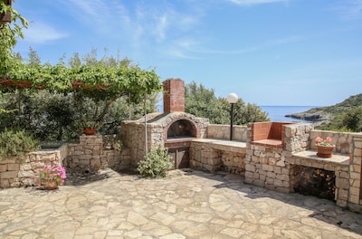 "La Piccola Pajara del Sale" Typical trullo overlooking the sea surrounded by olive trees