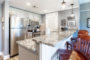 Fully equipped kitchen.  Washer & Dryer is behind vented door.  