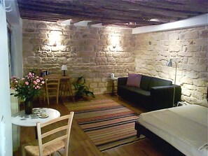 17th century stone walls and oak beams characteristic of the Marais