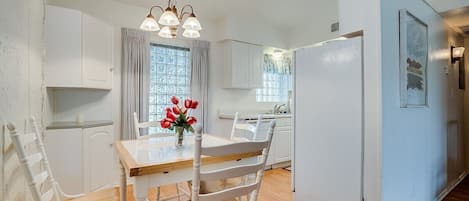 The inviting dining nook, which is attached to the kitchen, is the perfect place to enjoy breakfast or a game of cards.