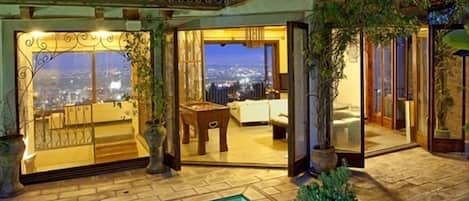 Looking across the pool and living room to the view of the city. 