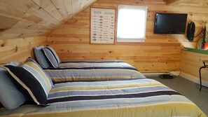loft with twin beds, TV and reading, seating area