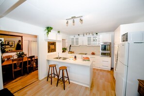 Newly installed kitchen, flows to lounge room & then onto private patio