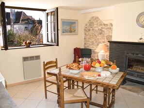 Enjoy the wood burning fireplace in the kitchen as you begin your day.