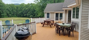 Back deck . Accessed by 4 back doors. Large backyard and field for games