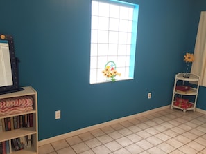 bedroom has a queen bed. Also contains books, games and beach towels