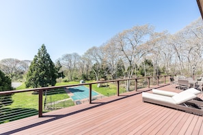 Middle floor's large deck with garden views, outdoor seating for 10, and grill.