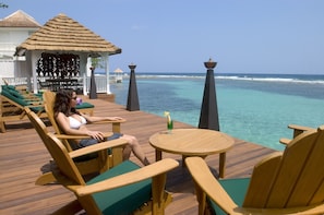 Relaxing with a cocktail on the deck at Bonne Amie Villa