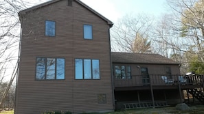 Back of house. The deck and windows overlook the bay.