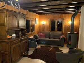 Lounge/sitting area with wood stove.