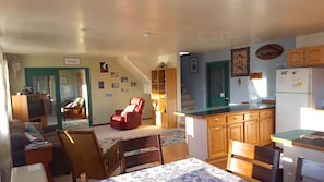 Looking from the dining area into the living room and media room
