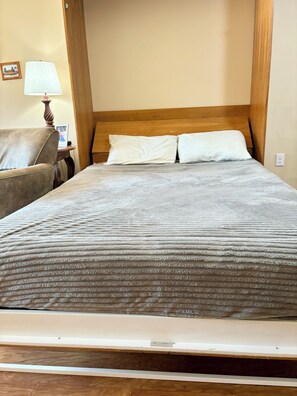 Murphy Bed down, real Queen mattress, folds down without moving table.