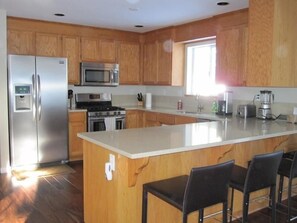 Kitchen with all new stainless steel appliances and quartz countertop