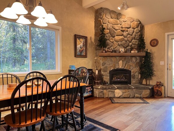 Dining Area for Six with Hardwood Floors and Gas Fireplace