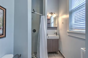 completely redone bathroom with nice stones on the shower floor that feel wonderful on your feet