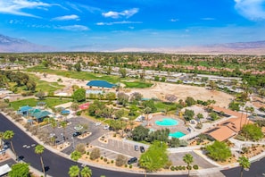 HOA Clubhouse with 2 pools, spa, sand volleyball, basketball court and gardens. 
