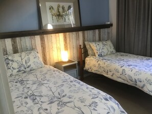 Bedroom 2 . Two singles. Option for 3rd Single.