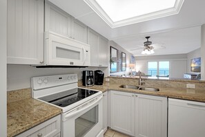 Cook in style with granite countertops and enjoy stunning ocean views right from the kitchen