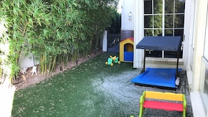 Kids play area with fake grass so safer for kids with allergies to ants, grass