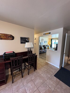 Desk area along kitchen entrance wall