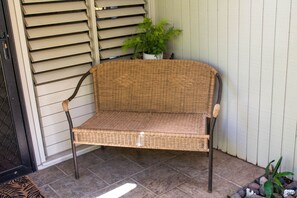 You can rest on a woven bench before you even open the door!