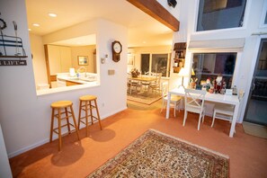 Entering the condo view, living room, kitchen & dining room