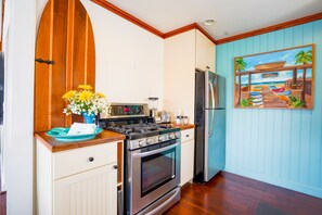 Kitchen contains essentials to cook a full meal. Salt, pepper & sugar too. 