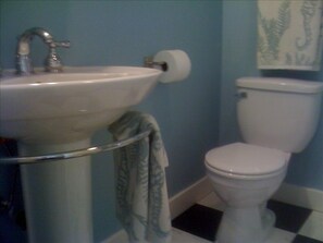 Sparkling Bathroom with Large Shower and Tall Shower Head