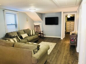 Living room with queen pull out sofa bed. 