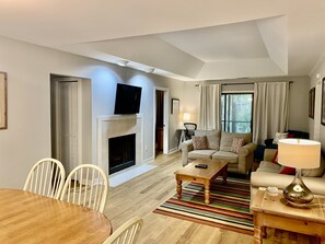 Flat screen TV and view to screened porch