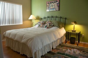 The downstairs bedroom features a queen bed, down comforter and two closets.