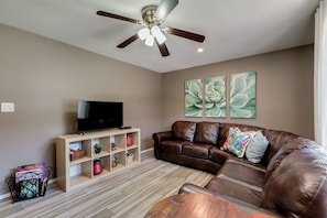 Relaxing Living Room with new Sectional and Smart TV for your entertainment