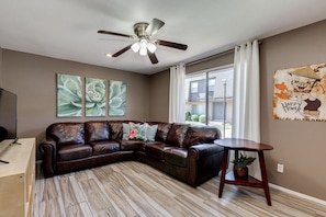 Relaxing Living Room with new Sectional and Smart TV for your entertainment