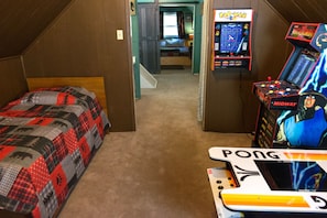 Upstairs kids bedroom with twin bed; (not shown), TV, futon and pinball machine.