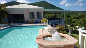 View of Villa Dawn, fountain, and pool.