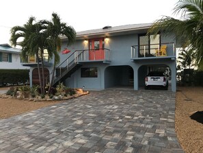 Newly installed paver driveways and new landscaping complement other updates.