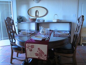 Dining room table extends to seat 8 people with side benches. 