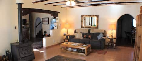 Main living area at Hacienda de Leyba with wood burning stove. 
