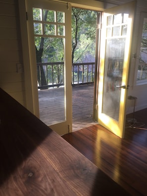 Beautiful evening light. French doors open to deck with great river views.