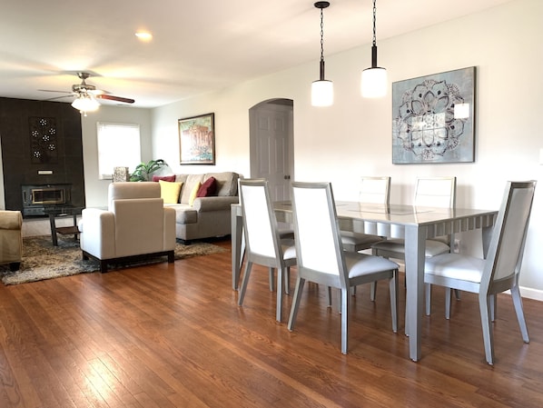 You are welcomed by the open floor plan of dining/living room to the left.