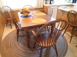 Dining area with views of seasonal stream, wooded area and open field.