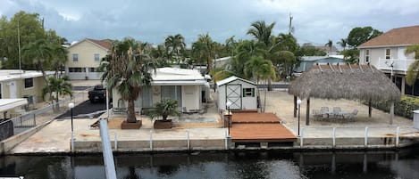 Waterfront with dock and parking space for boats and cars