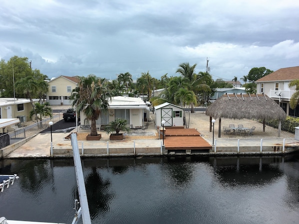 Waterfront with dock and parking space for boats and cars