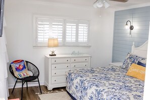MASTER BEDROOM WITH SLIDING DOOR, AND WINDOW WITH THE VIEW OF THE BEAUTIFUL GULF