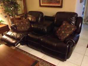 New power recline leather sofa with center concole. Very comfortable!