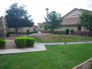 Well maintained landscape -covered parking is convenient and close. 