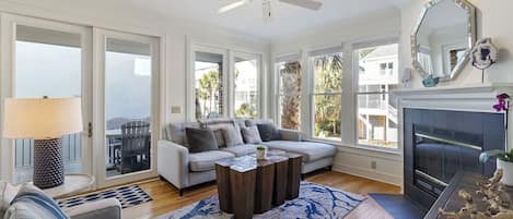 Beautiful open and bright living room with lots of seating.